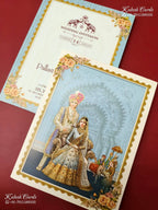 KLB-1192 Creme Blue Raja Rani Semi Box Wedding Card (2 Page)