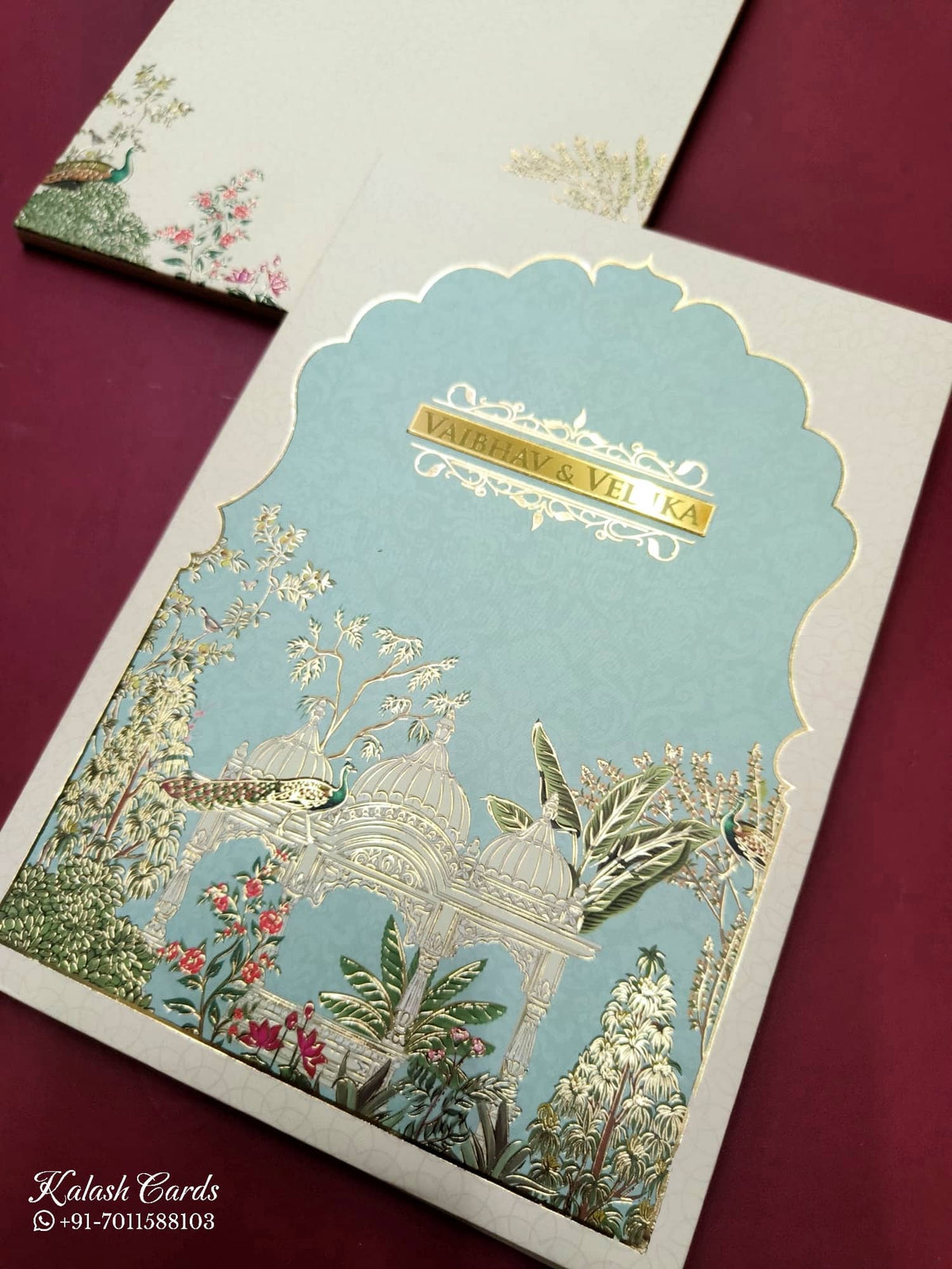 KLB817 Royal Fort Peacock Design Creme Blue Color Hardboard Padding Thick Wedding Card (2 Page & Couple Name Acrylic)