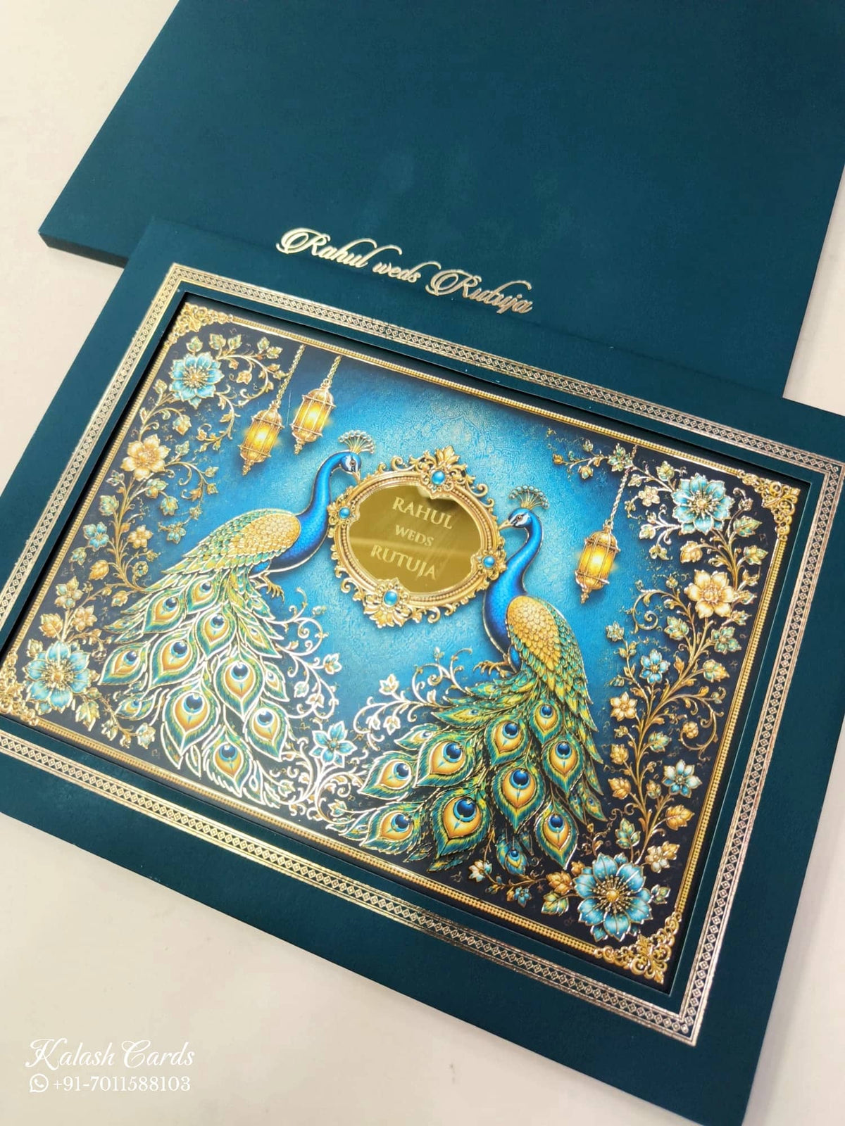 KLB848 Peacock Design Blue Color Leatherette Hardboard Padding Thick Wedding Card (2 Page & Couple Name Acrylic)