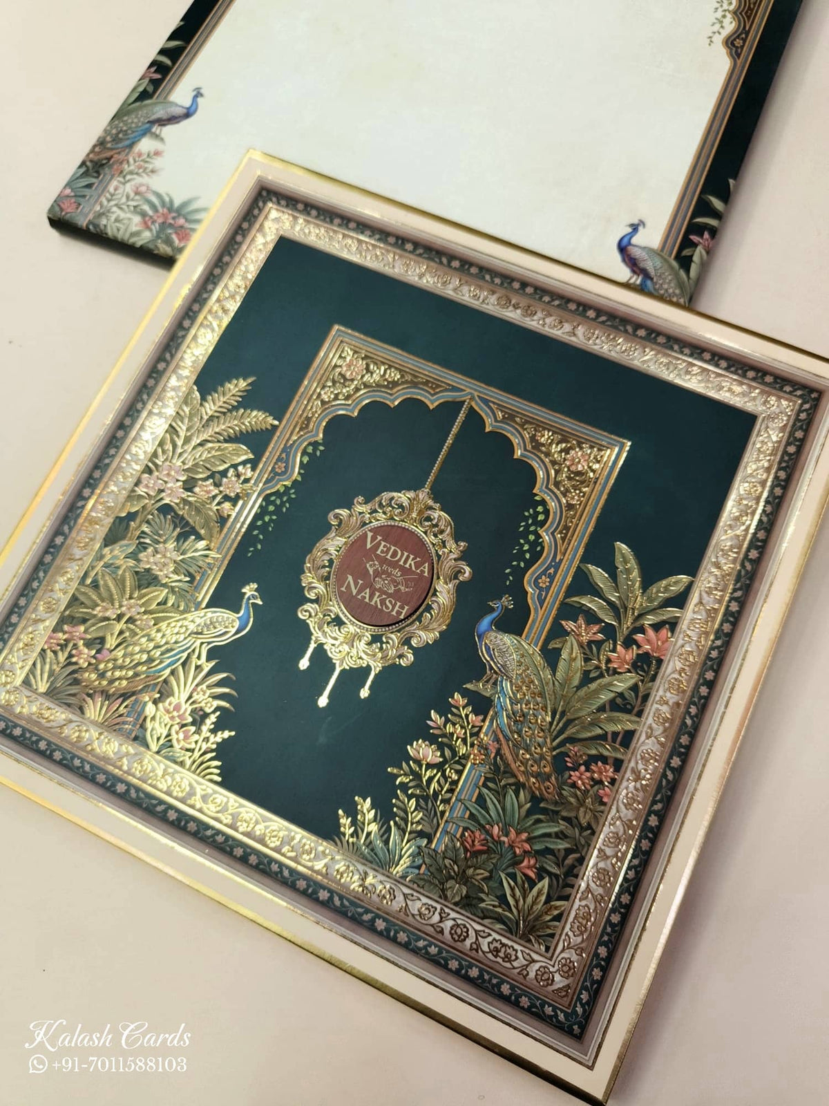 KLB886 Peacock Design Blue Green Color Premium 3D Gold Foil Hardboard Padding Thick Wedding Card (2 Page & Couple Name Wooden Plate)-Kalash Cards