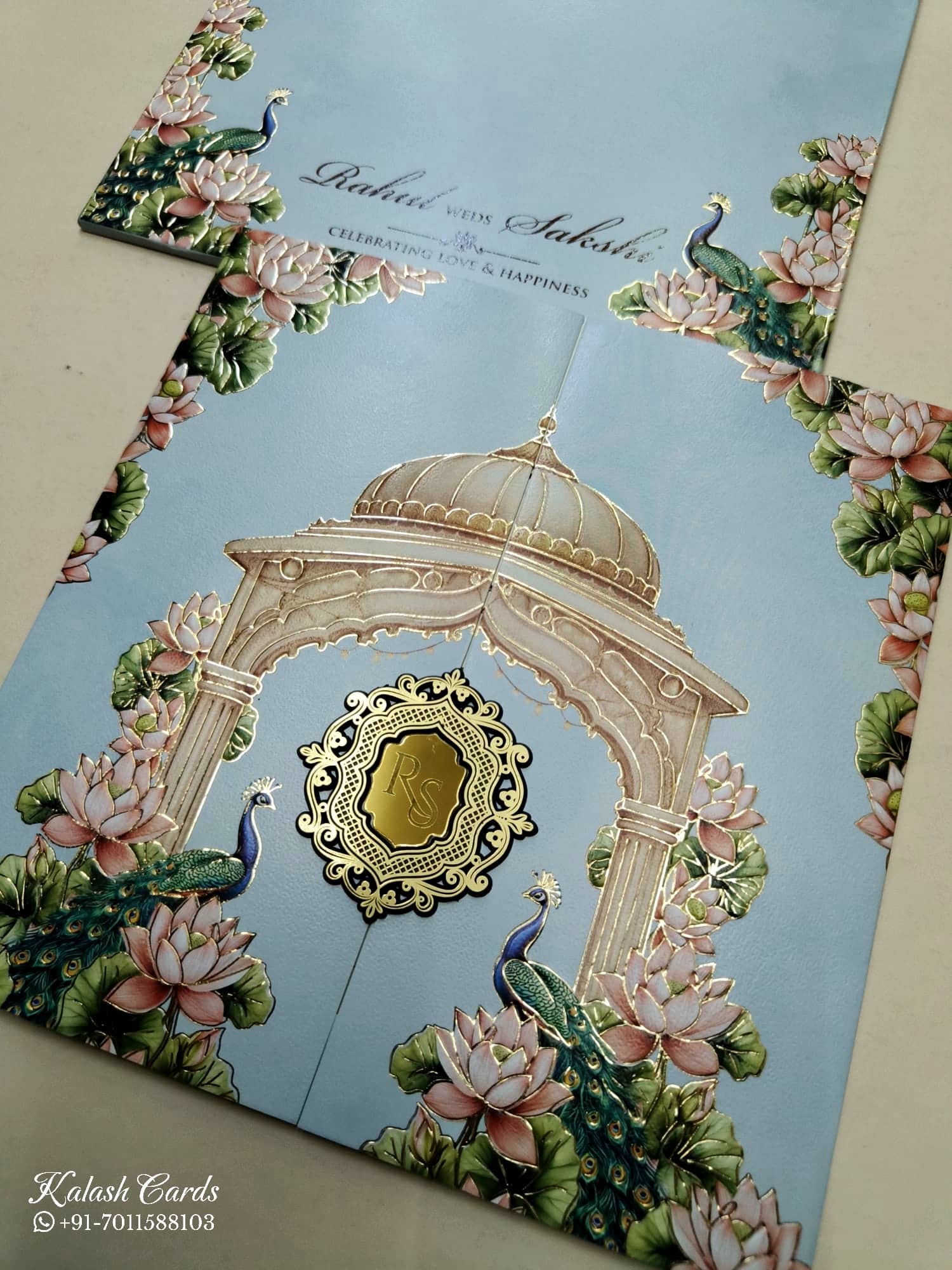 KLB751 Lotus Peacock Design Blue Color Double Door Style Embossed Semi Box Wedding Card (2 Page & Couple Initial Acrylic)