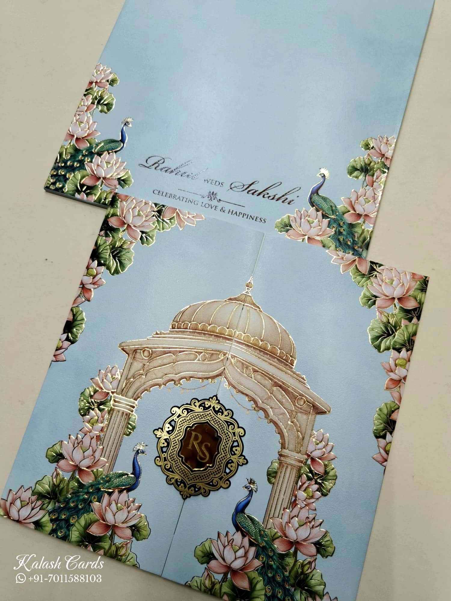 KLB751 Lotus Peacock Design Blue Color Double Door Style Embossed Semi Box Wedding Card (2 Page & Couple Initial Acrylic)
