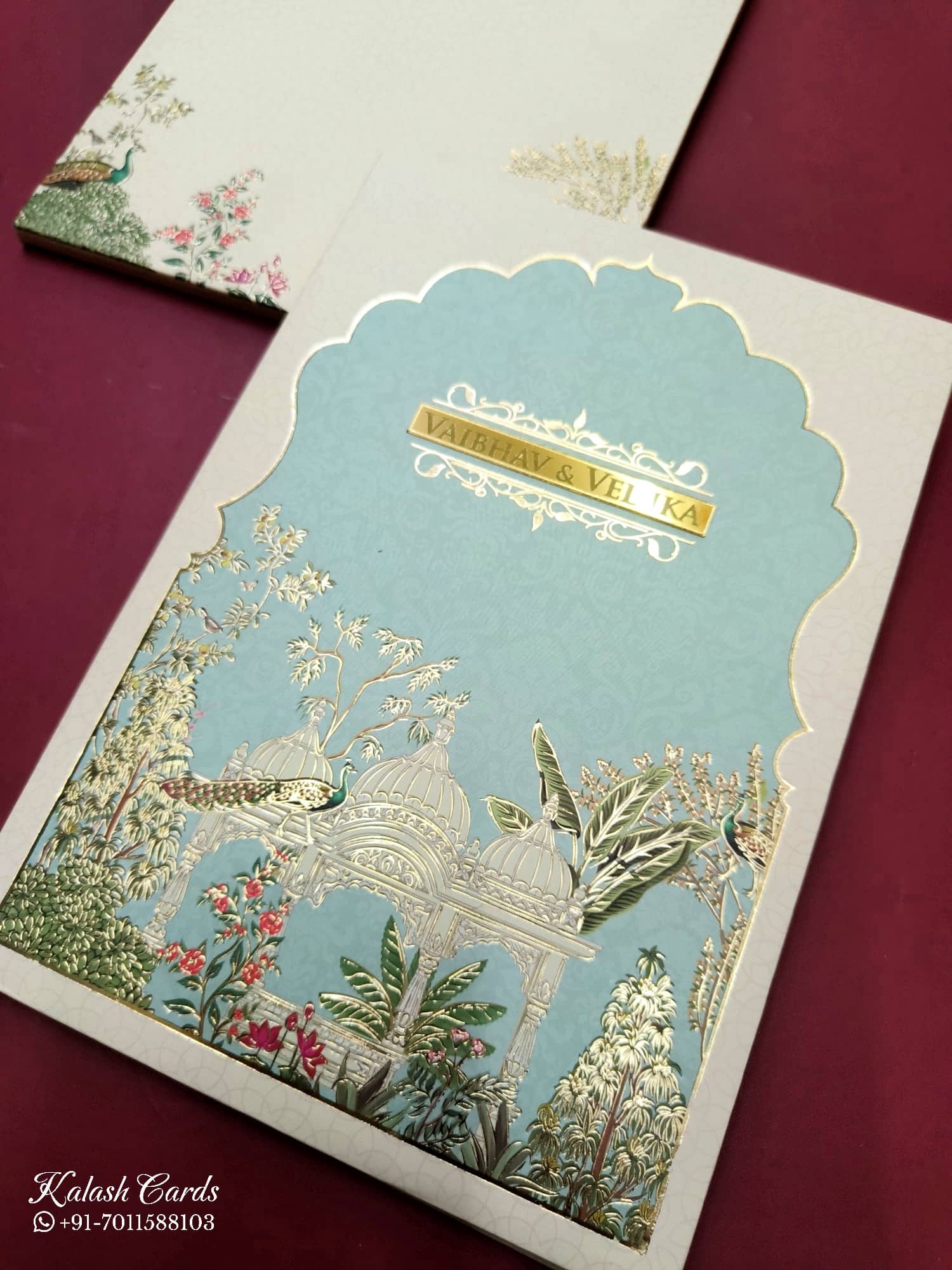 KLB817 Royal Fort Peacock Design Creme Blue Color Hardboard Padding Thick Wedding Card (2 Page & Couple Name Acrylic)