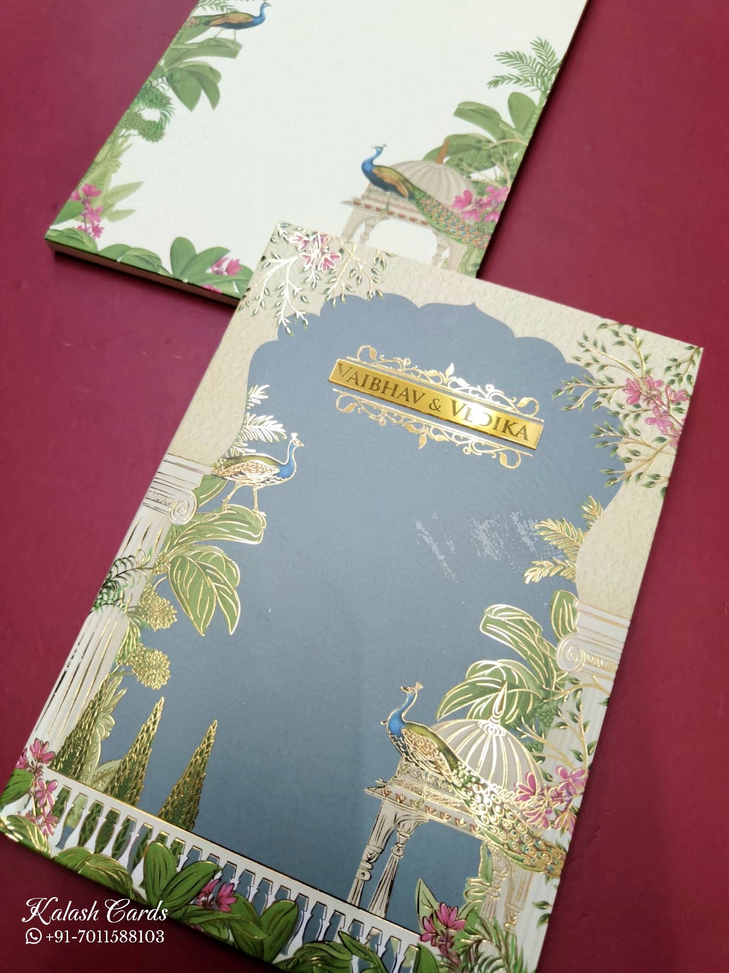 KLB829 Royal Fort Peacock Design Creme Blue Color Hardboard Padding Thick Wedding Card (2 Page & Couple Name Acrylic)
