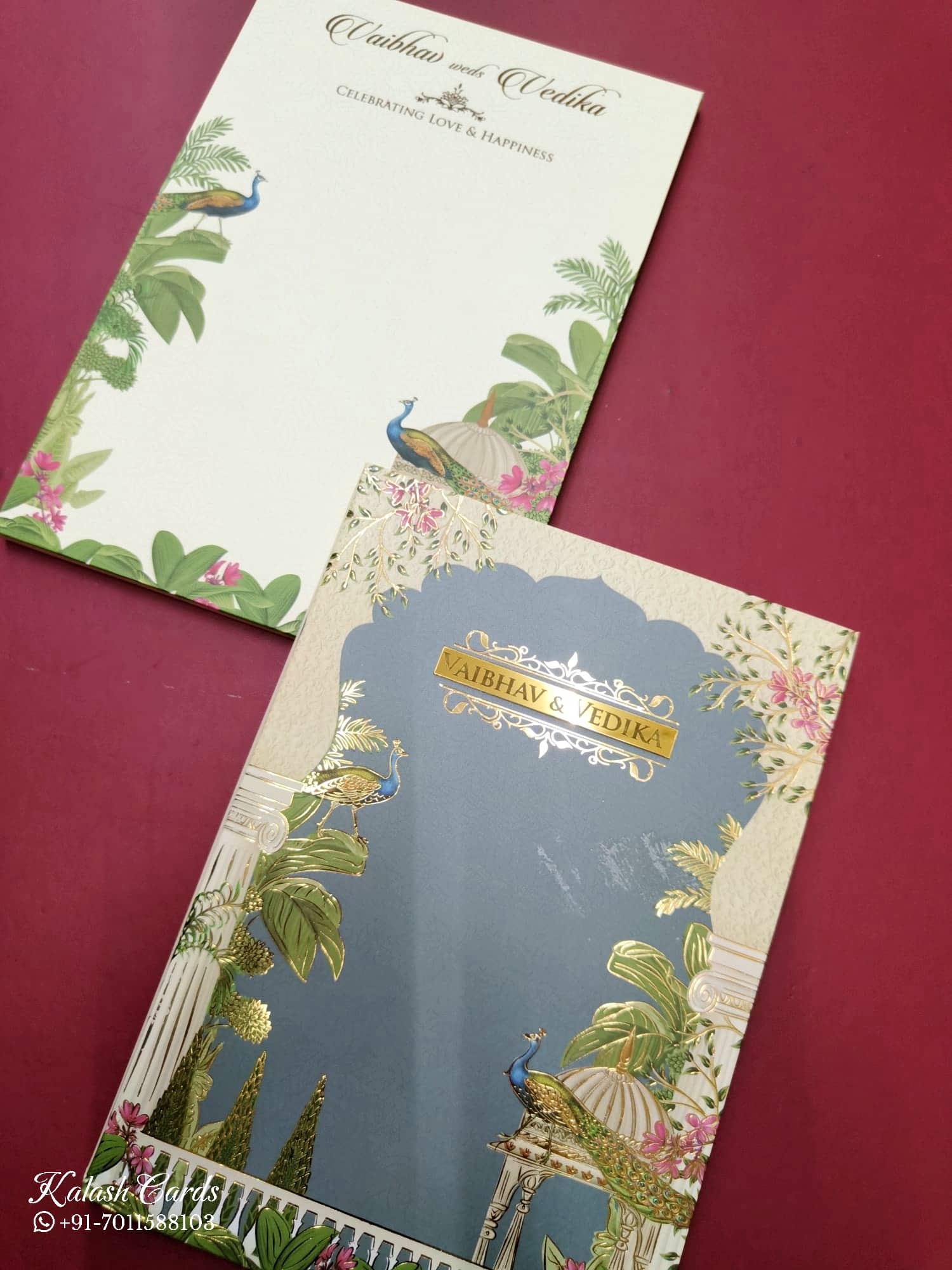 KLB829 Royal Fort Peacock Design Creme Blue Color Hardboard Padding Thick Wedding Card (2 Page & Couple Name Acrylic)