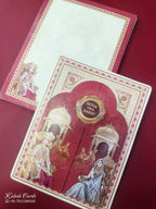 KLB871 Raja Rani Design Creme Maroon Color Double Door Style Semi Box Wedding Card (2 Page & Couple Name Wooden Plate)