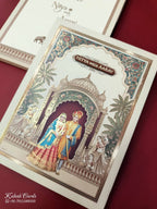 KLB890 Raja Rani Design Creme Color Premium 3D Gold Foil Hardboard Padding Thick Wedding Card (2 Page & Couple Name Wooden Plate)
