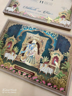 KLB935 Royal Blue Pichwai Radha Krishna Laser Cut Padded Thick Wedding Card (2 Page & Couple Name Wooden Plate)