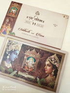 KLB943 Creme Brown Radha Krishna Ganesh Ji Padded Thick Wedding Card (2 Page & Couple Name Wooden Plate)