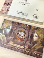 KLB944 Brown Radha Krishna Ganesh Ji Padded Thick Wedding Card (2 Page & Couple Name Wooden Plate)