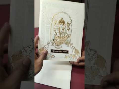 KLB-1562 White Ganesh Ji Embossed Semi Box Wedding Card (2 Page & Couple Name Wooden Plate)