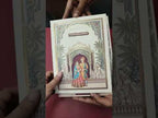 KLB890 Raja Rani Design Creme Color Premium 3D Gold Foil Hardboard Padding Thick Wedding Card (2 Page & Couple Name Wooden Plate)