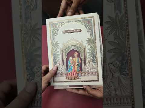 KLB890 Raja Rani Design Creme Color Premium 3D Gold Foil Hardboard Padding Thick Wedding Card (2 Page & Couple Name Wooden Plate)