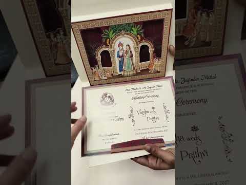 KLB900 Royal Fort Design Creme Maroon Color Premium 3D Gold Foil Hardboard Padding Thick Wedding Card (2 Page & Couple Name Wooden Plate)